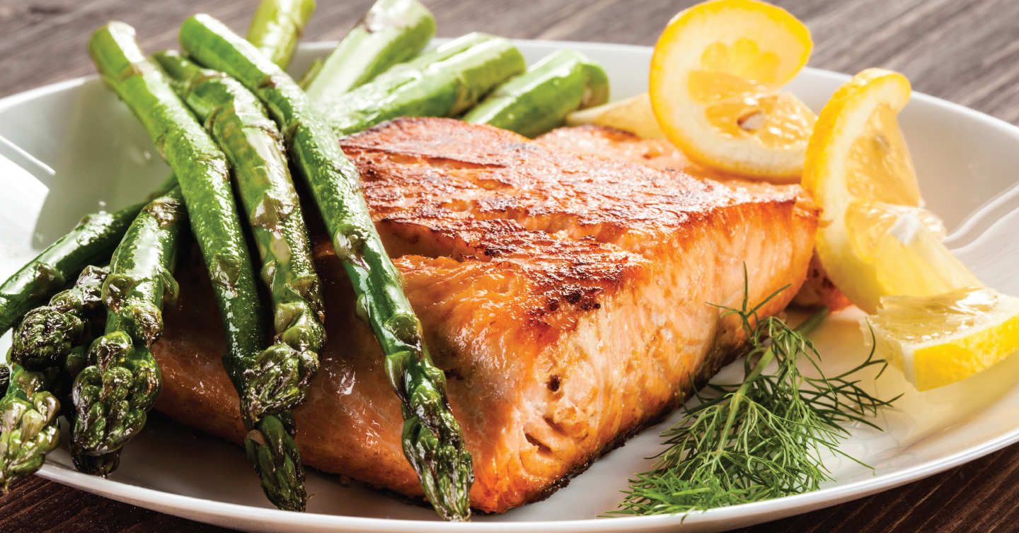 healthy salmon meal with lemon and asparagus