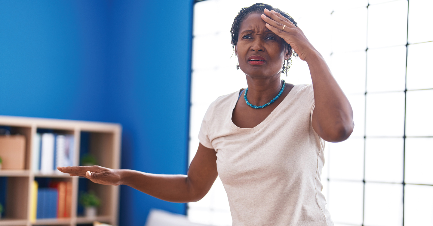 a senior person feeling dizzy in their home