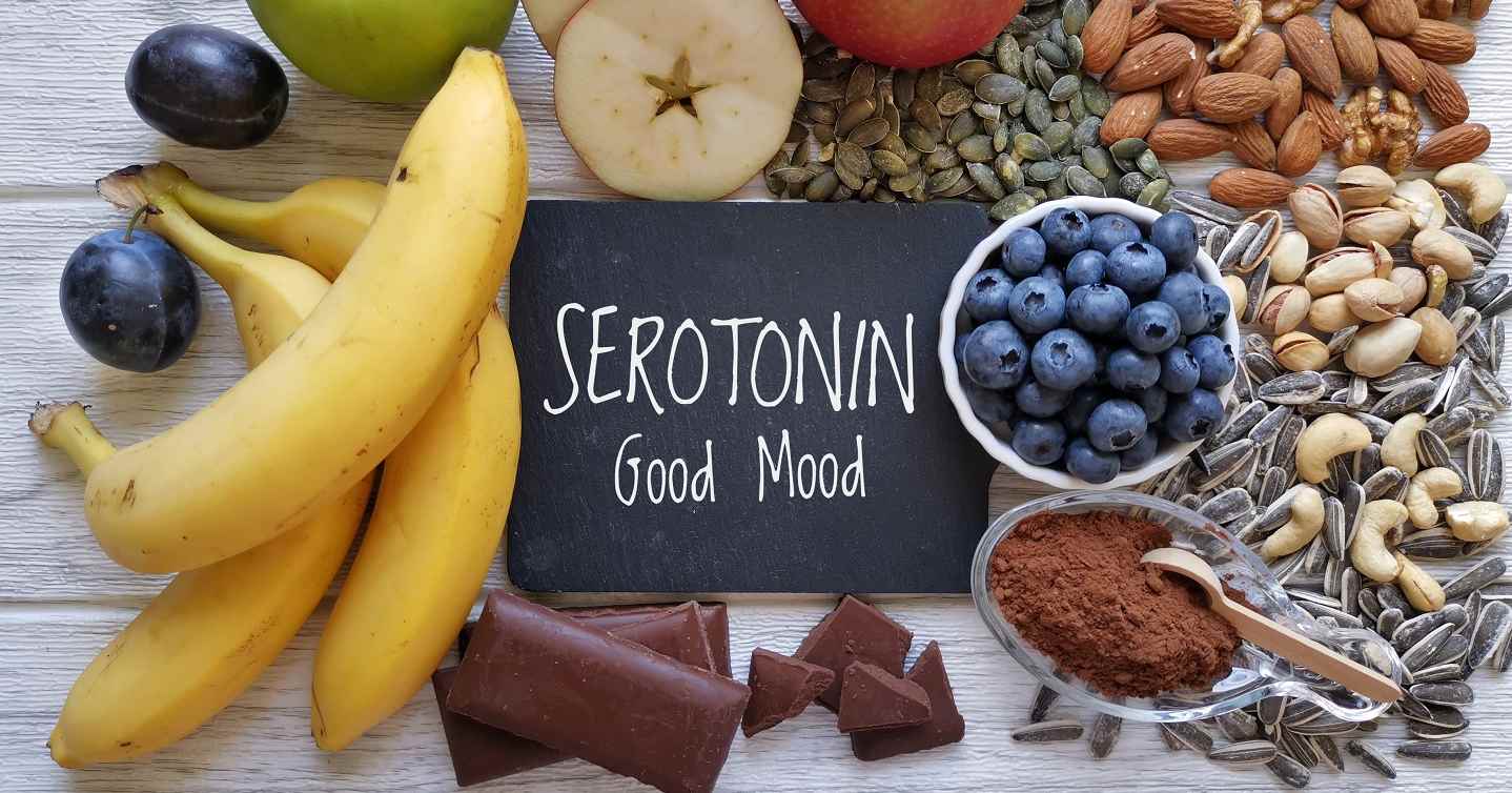 words on a blackboard surrounded by different healthy foods